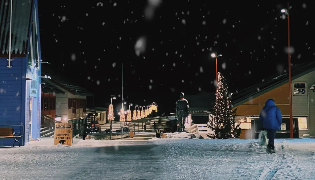 Snow falling over the Christmas tree in Longyearbyen town square